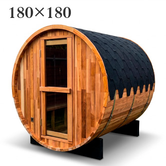Wooden barrel-shaped sauna on two black supports, with a glass-paneled door and small window on the curved front edge.