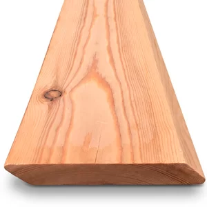 Close-up of a smooth pine board edge showing natural grain and a knot in warm wood tones